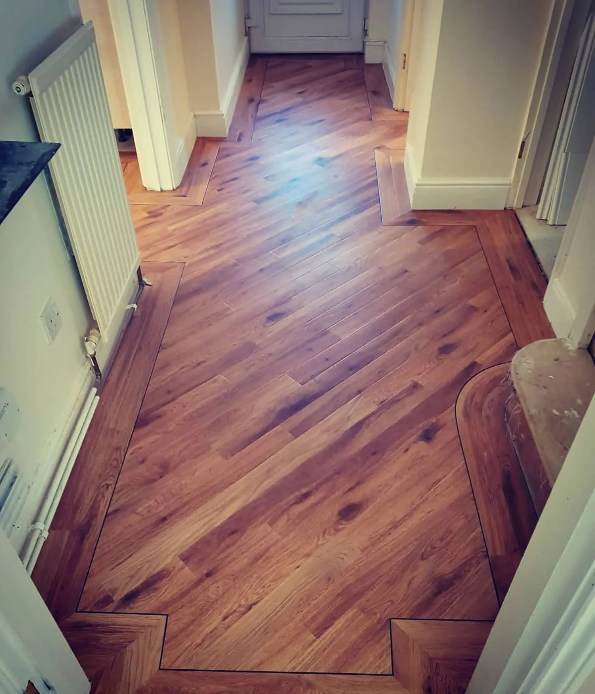 Karndean herringbone hallway with a border