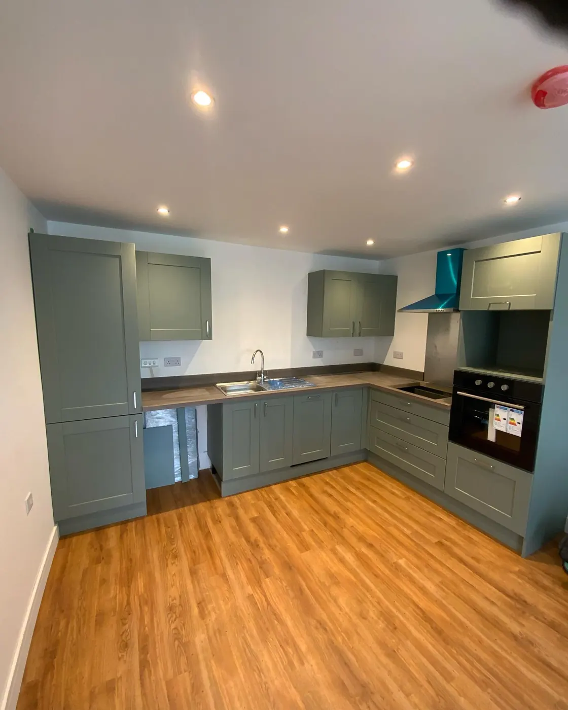 Sage green fitted kitchen