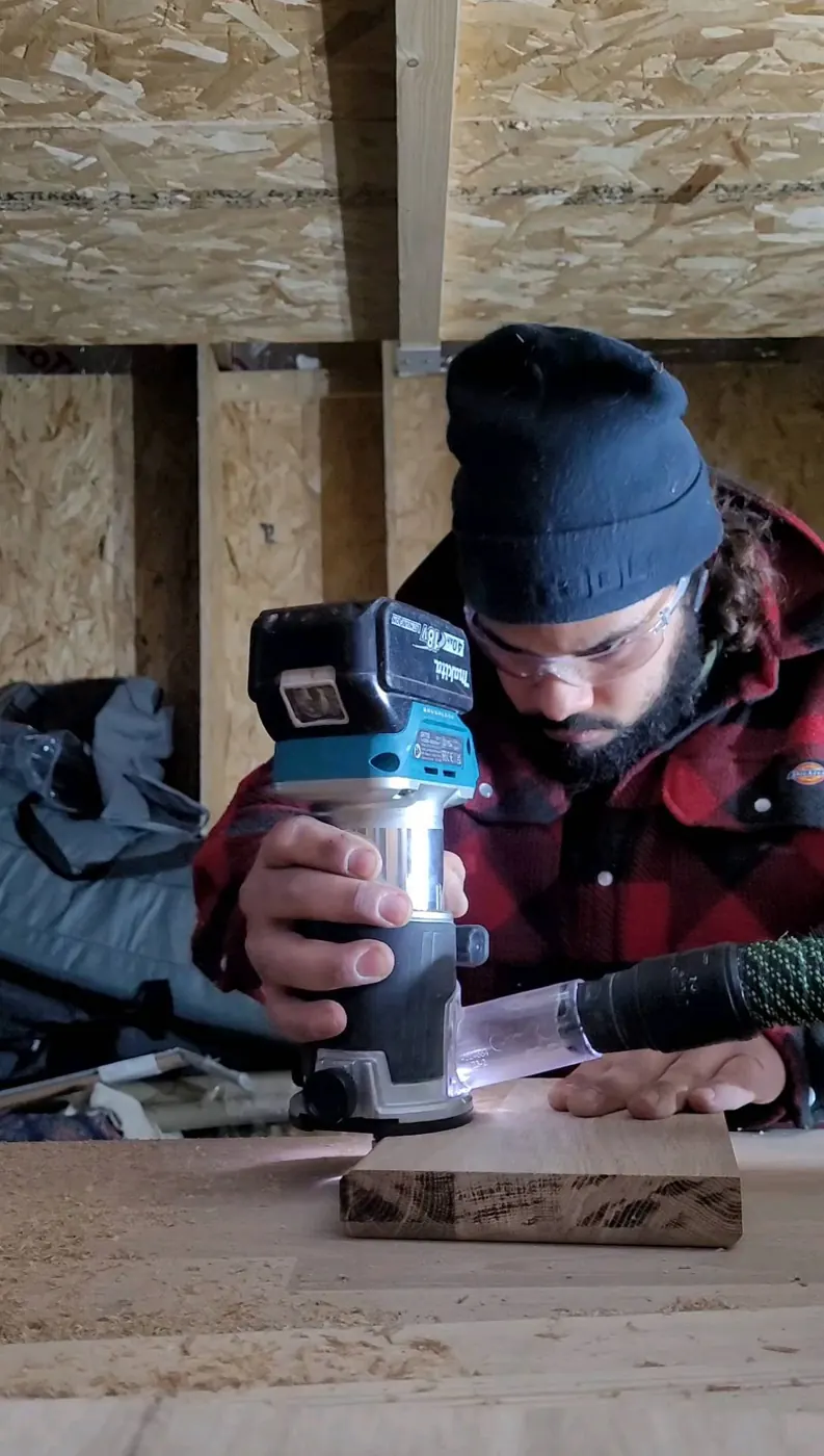 Imran Romjon routing a piece of oak
