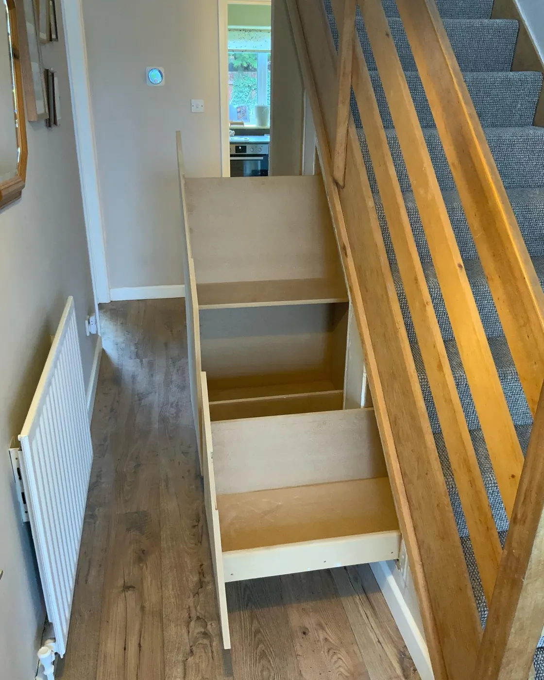 Pull-out drawers under a staircase